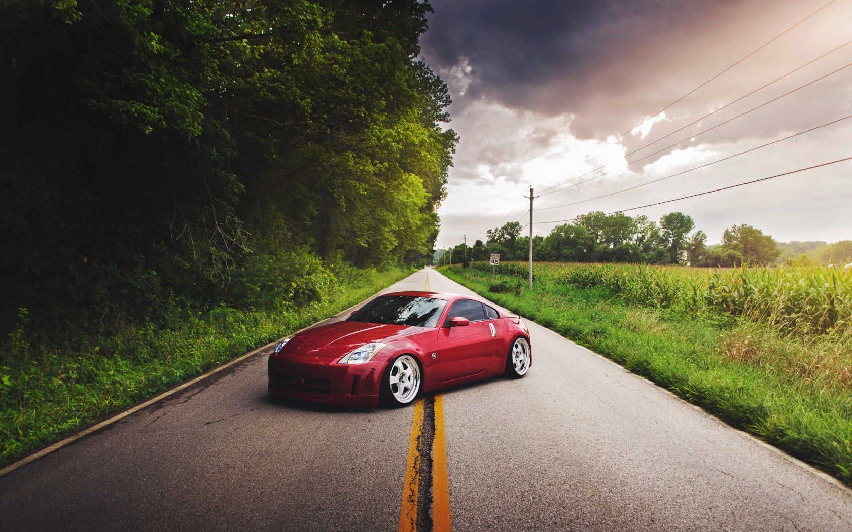 nissan_350z_red_car_tuning_wallpaper_1680x1050.jpg