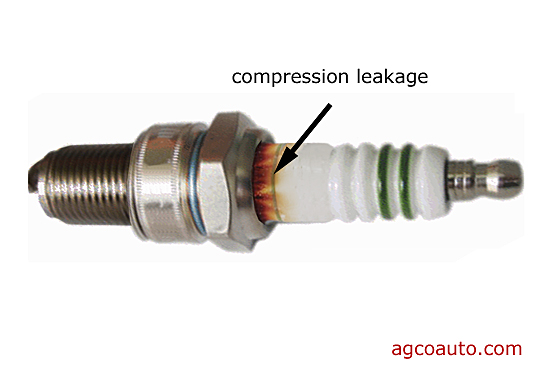 spark_plug_leaking_around_ceramic.jpg