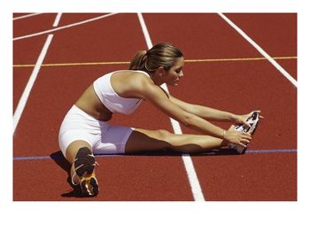 SuperStock_1406R_101_Woman_Stretching_on_a_Running_Track_Posters.jpg