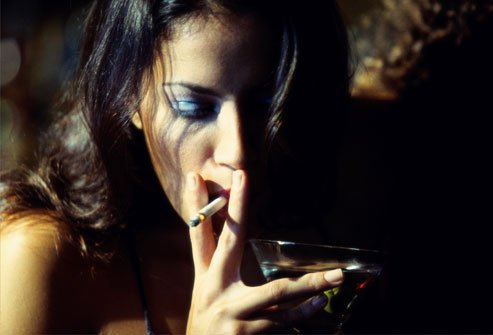 getty_rf_photo_of_woman_smoking_cigarette_with_martini.jpg