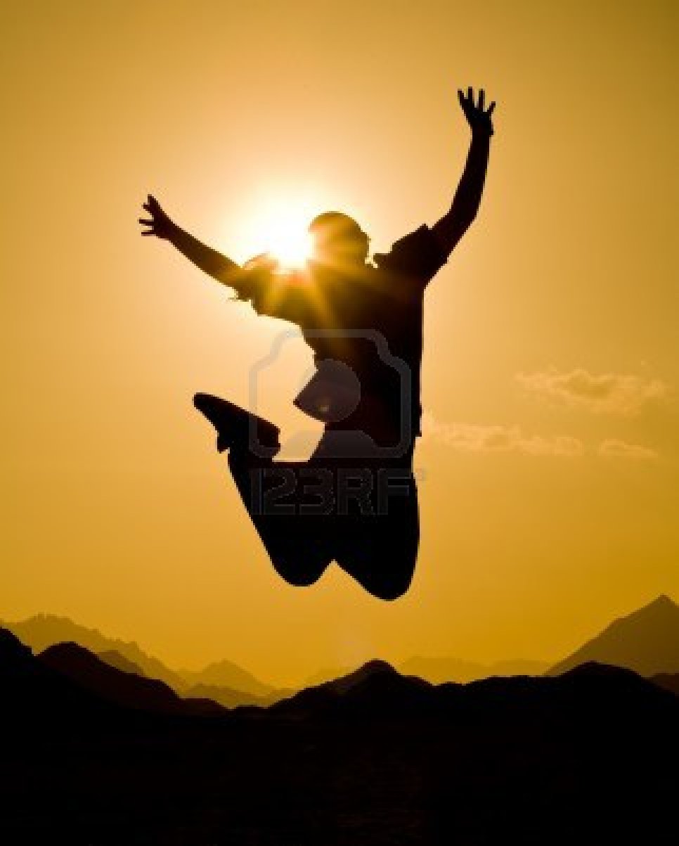 7935319_black_silhouette_of_man_in_happy_jump_on_orange_sunset_sky_and_desert_mountain_background.jpg