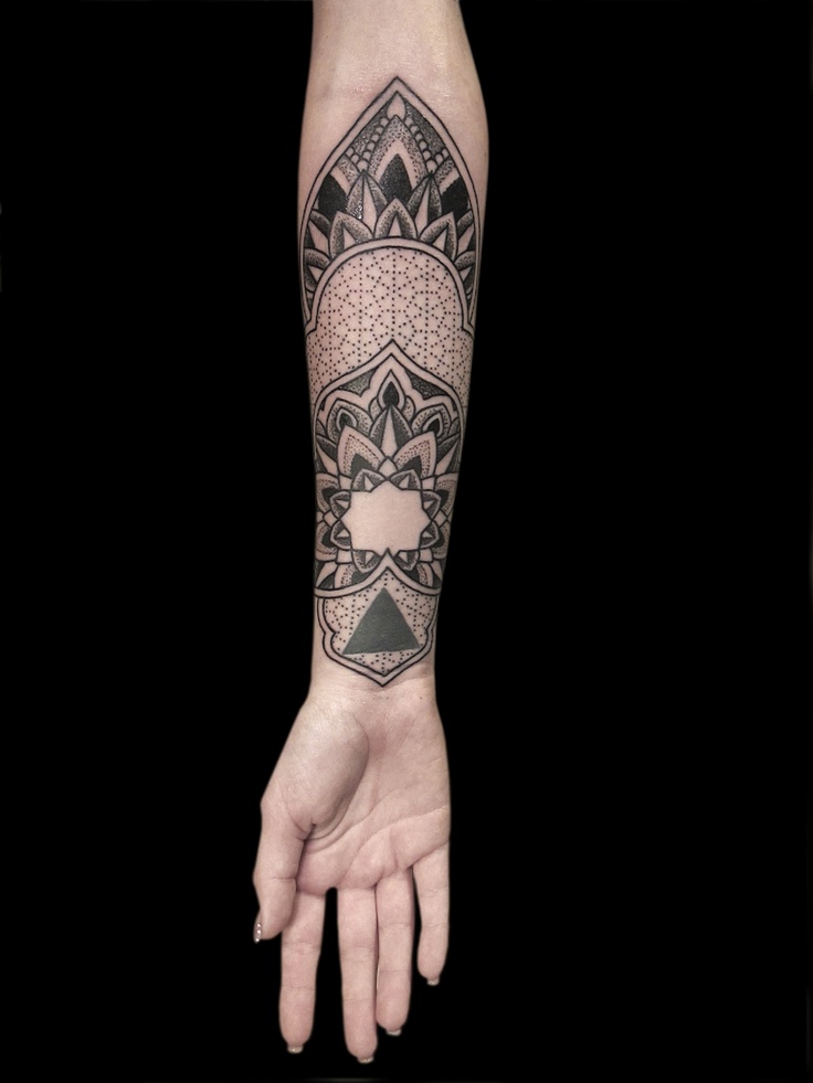 This_sacred_geometry_and_mandala_tattoo_by_Nazareno_Tubaro_uses_a_dotwork_technique_to_create_different_shades_643x857.jpg