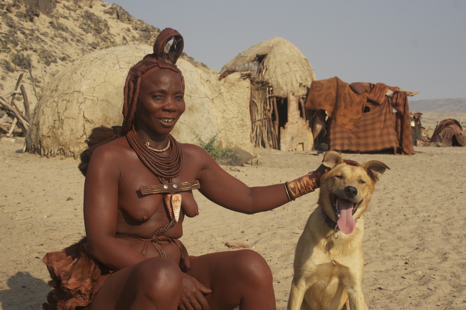 Bow_Wow_being_patted_by_Himba_woman_in_Purros_Nambia_Africa.jpg