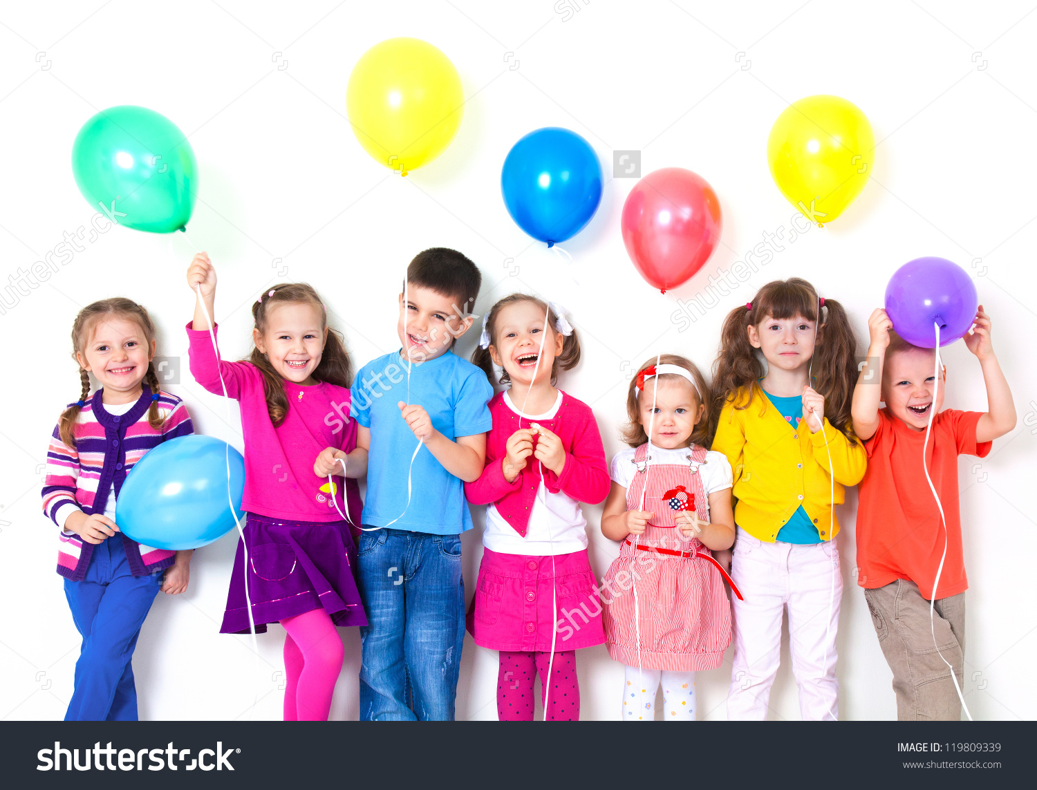 stock_photo_big_group_of_happy_children_with_balloons_at_white_wall_119809339.jpg