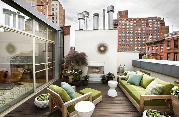 roof_terrace_with_outdoor_fireplace_teak_furniture_and_a_container_garden.jpg