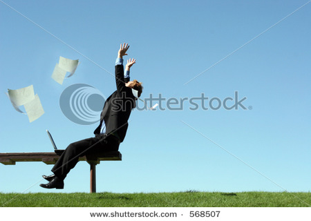 stock_photo_papers_float_through_the_air_as_a_young_businessman_throws_his_hands_in_the_air_in_joy_568507.jpg