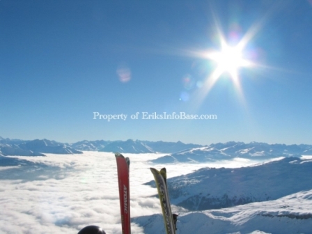 Laax_with_Chris_skis_sun_clouds_inversion_mountain_snow_blue_sky_valley.jpg