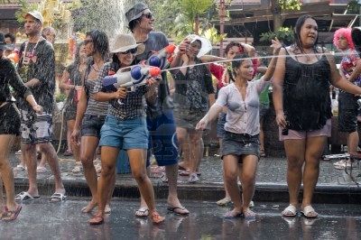 6896648_bangkok__april_15_people_celebrating_songkran_thai_new_year__water_festival_in_the_streets_by_dancin.jpg