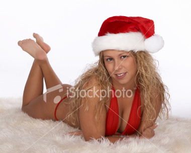 ist2_2359859_santa_in_red_bikini_lying_on_stomach_with_ankles_crossed.jpg