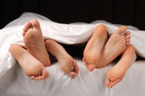 3_pairs_of_feet_in_bed_300x1981.jpg