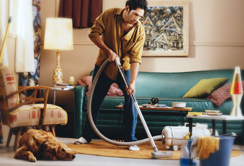 getty_rm_photo_of_man_cleaning_with_dog_nearby.jpg
