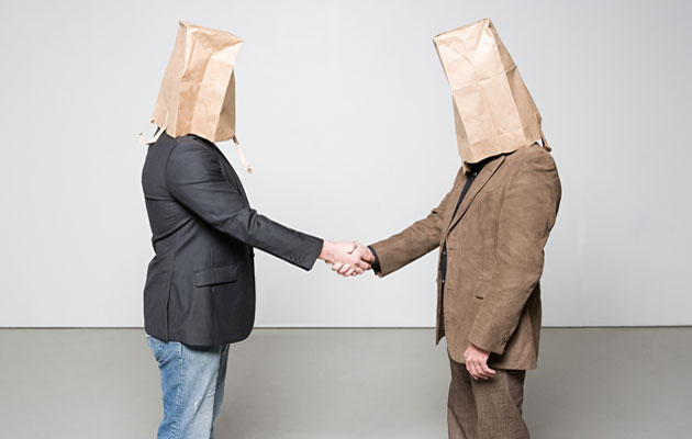 Full201011041318461203799_men_with_paper_bags_on_heads_handshake.jpg