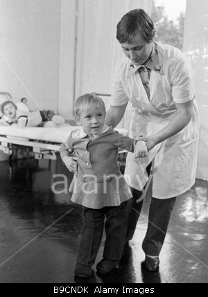 Mother_helps_Rasa_Prascevichute_to_take_her_first_steps_after_the_B9CNDK.jpg