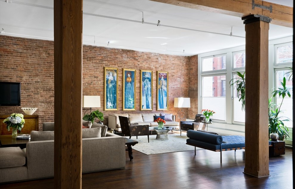 Brick_Wall_Studio_Apartment_by_Stephan_JAKLITSCH_GARDNER_exposed_beam_living_with_formal_lounge_and_entertainment_area_teal_accents.jpeg