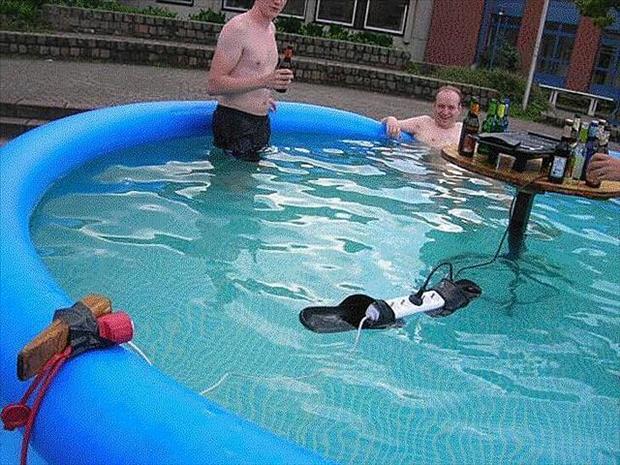 men_in_pool_with_electrical_outlets.jpeg