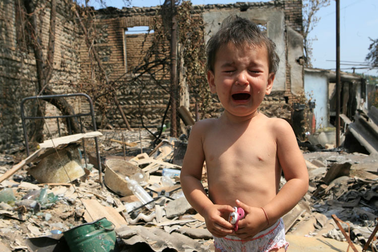 south_ossetia_child_city_ruined.jpg