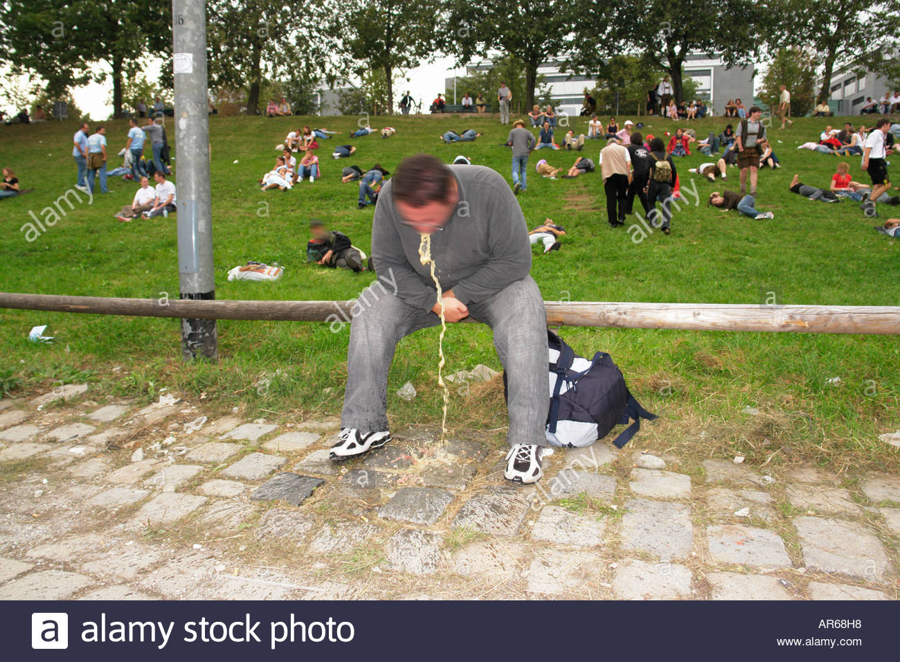 drunken_man_vomiting_on_the_way_back_home_oktoberfest_in_theresienwiese_AR68H8.jpg