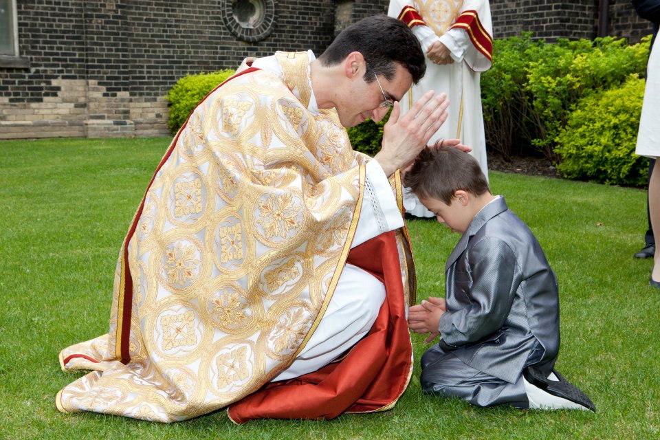 New_20Toronto_20priest_20blesses_20child_20May_202012_1_.jpg