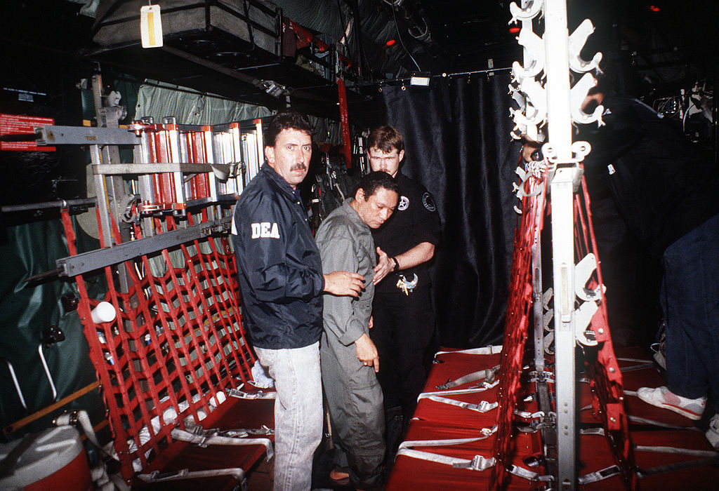 1024px_Manuel_Noriega_with_agents_from_the_U.S._DEA.jpg