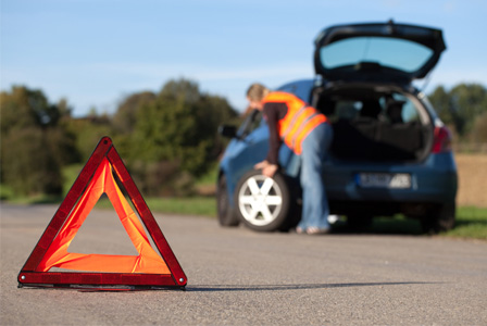 woman_changing_tire_cx9o9h.jpg