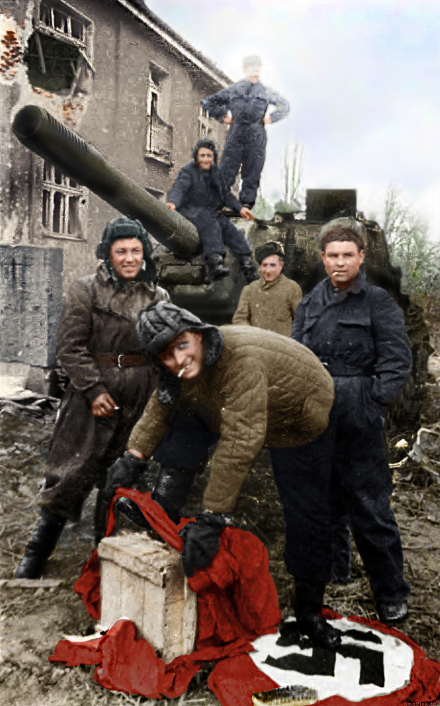 lieutenant_tovolzhansky_wipes_his_boots_with_nazi_flag_at_acs_ics_152_deerslayer_on_the_street_of_breslau_1945.jpg