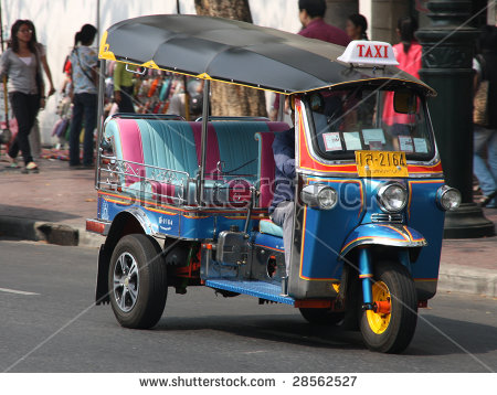 stock_photo_bangkok_january_famous_three_wheeled_taxi_tuktuk_on_the_street_january_in_bangkok_28562527.jpg