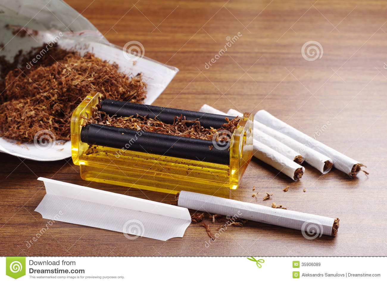 rolling_machine_cigarettes_brown_table_35906089.jpg