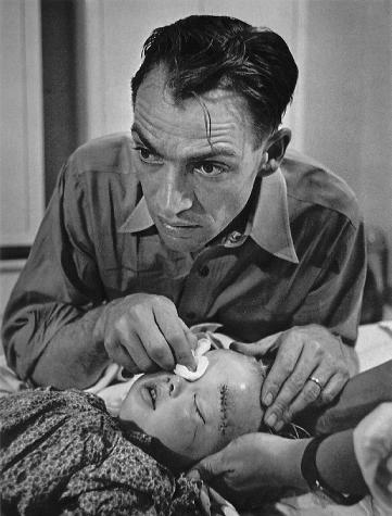 W._Eugene_Smith_dr_ceriani_with_injured_child.jpg
