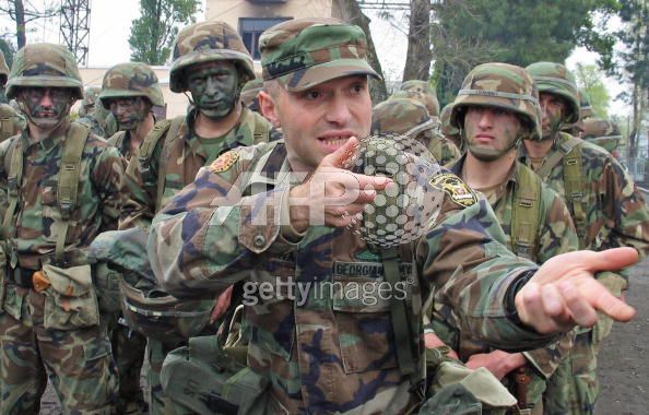 A_Georgian_army_officer_talks_to_his_soldiers_during_a_military_exercise_near_the_town_of_Poti__O1_May_2004.jpg