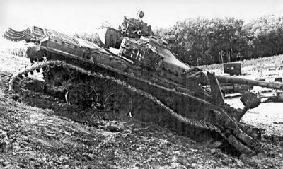 MBT_demolished_by_indirect_155mm_HE_hit.jpg