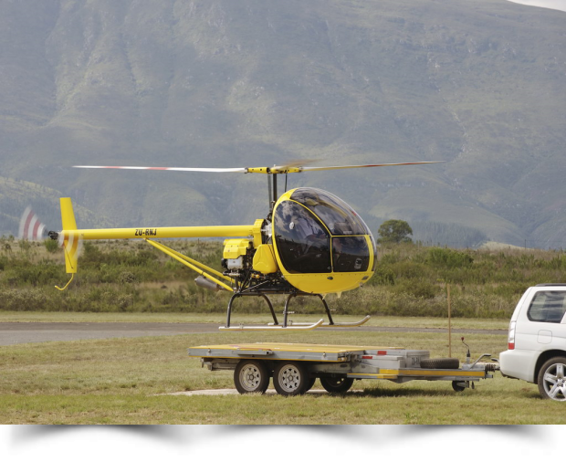 019_light_helicopter_kit_aerocopter_ak1_landing_on_car_trailer.png