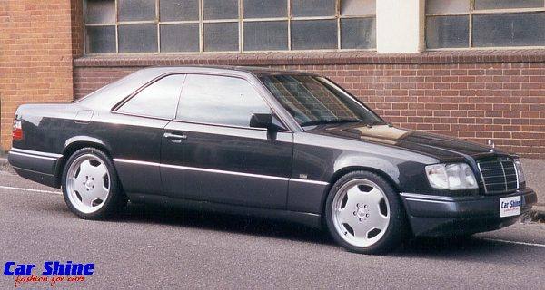 Mercedes_124_Coupe_Side_Front_Grey_AMG_Style_18_Eibach_Springs_and_Clear_Blinkers_View.jpg