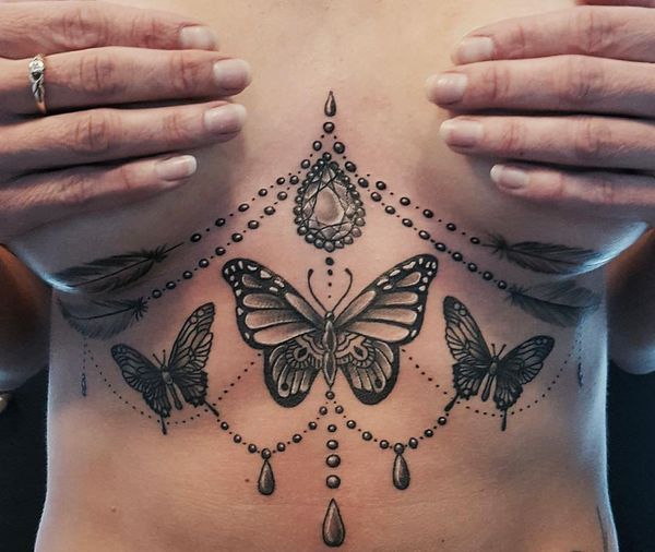 12_Fabulous_butterfly_tattoo_under_the_breast.jpg