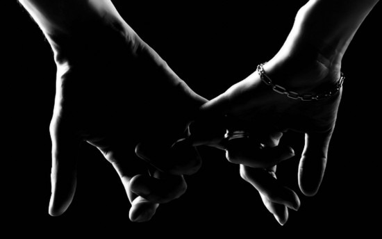 RomanceBlackWhite_ManWomanHoldingHandsChains.jpg