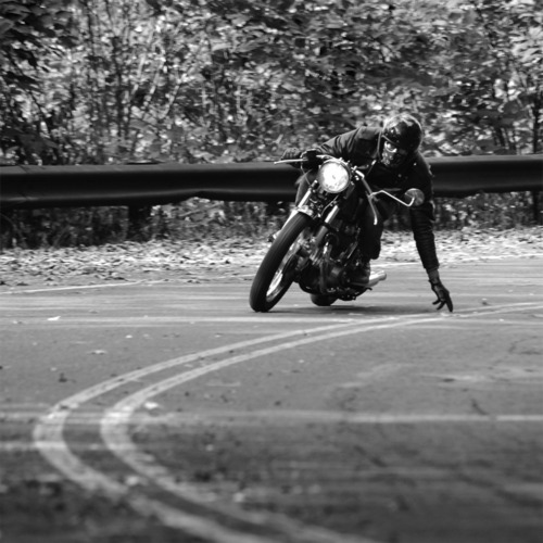 motorbike_rider_cornering_in_black_and_white.jpg