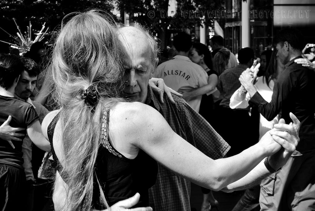 london_england_spitalfields_samba_dancing_dancers_elderly_old_man_portrait_candid_street_photography_streettogs_city_urban_bw_black_white_bw_monochrome_rob_cartwright.jpg