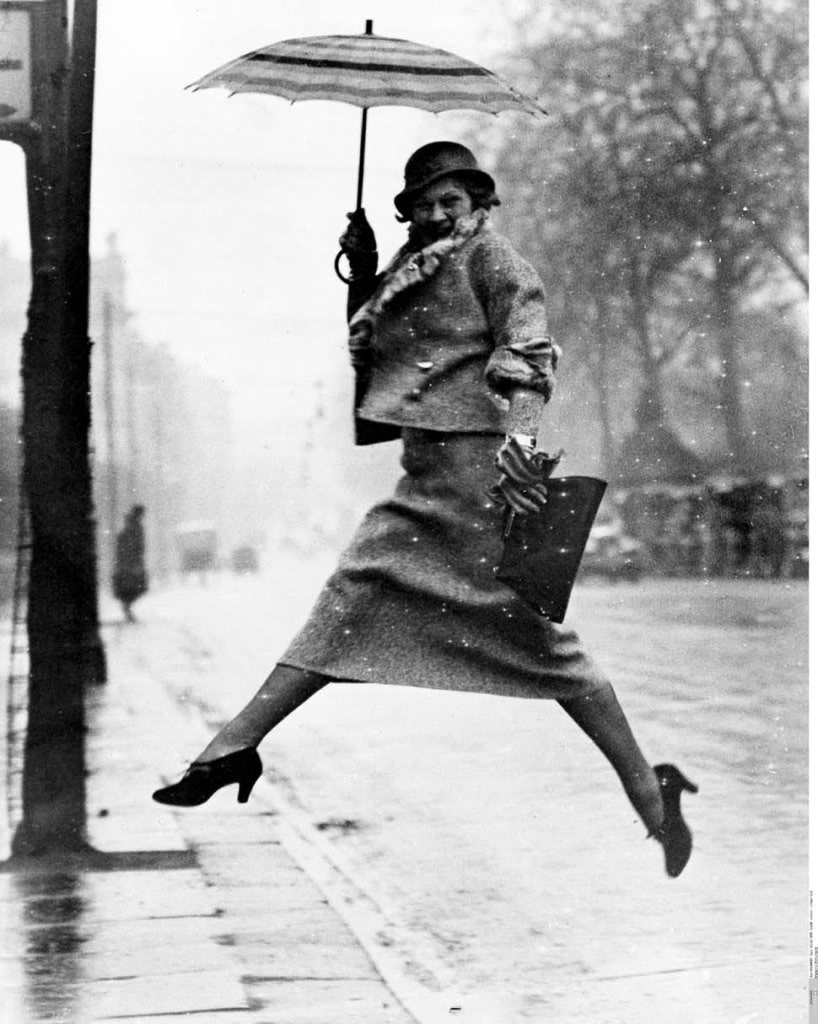 Martin_Munkacsi___Jumping_a_puddle__Harper___s_Bazaar_April_1934.jpg