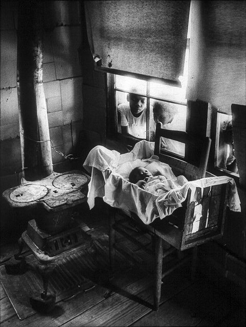 Newborn_Baby_in_Makeshift_Crib_near_Cold_Stove__South_Carolina__1951__by_W._Eugene_Smith.jpg
