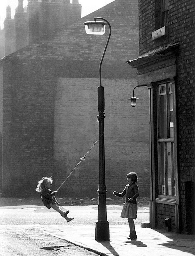 Shirley_Baker______Girls_swinging_on_a_lamppost_____Manchester__1965.jpg