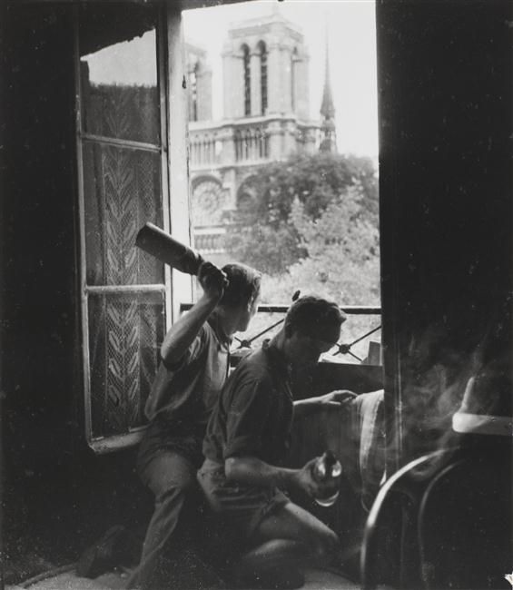 Molotov_cocktail_aimed_at_the_German_occupiers_of_France__Rue_du_Petit_Pont__Paris__1944____Robert_Doisneau._France_WWII_War.jpg