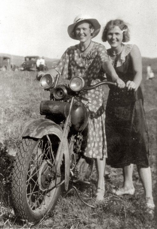 Two_women_riding_a_motorcycle_in_rural_Nebraska_between_1925_and_1935..jpg