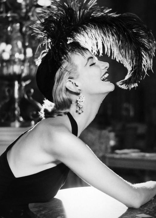 Sunny_Harnett__dress_by_Traina_Norell__hat_by_Walter_Florell__photo_by_Richard_Avedon__Paris__July_1951.jpg