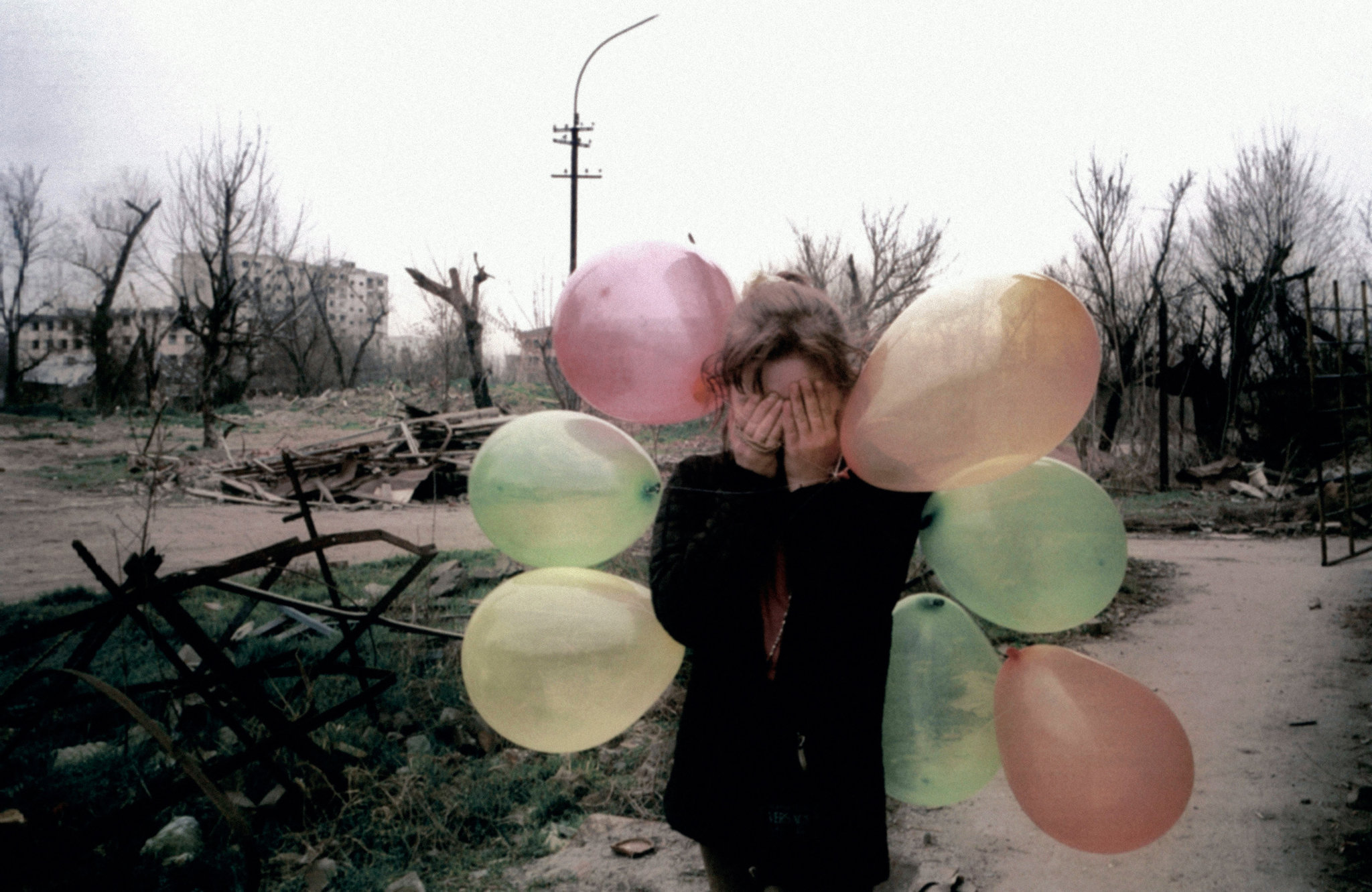 Girl_with_balloons__Grozny__Chechnya._March_2002.____Thomas_Dworzak._Magnum_Photos.jpg