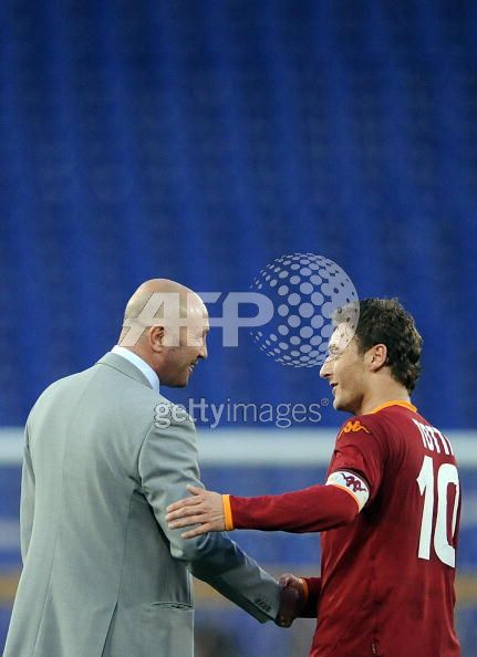 AS_Roma__s_forward_and_captain_Francesco_Totti__R__shakes_hands_with_Catania__s_coach_Walter_Zenga_after_their_Italian_Tim_Cup_football_match_at_Olympic_stadium_in_Rome_on_April_16__2008.jpg