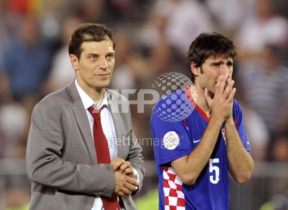 he_coach_of_the_Croation_national_football_team_Slaven_Bilic__L__and_Croatian_midfielder_Ivan_Rakitic_react_at_the_end_of_the_Euro_2008_Championships_quarter_final_match_Croatia_vs._Turkey_on_June_20__2008_at_Ern.jpg