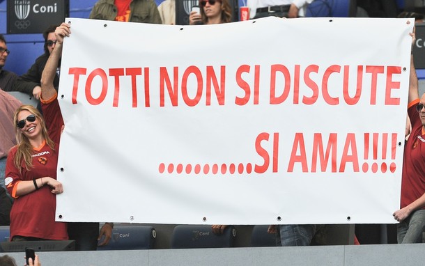 The_wife_of_AS_Roma__s_forward_Francesco_Totti__Ilary_Blasi__holds_a_banner_reading___Totti__don__t_discuss_him..._love_him__before_the_AS_Roma_Italian_Serie_A_football_match_against_Cagliari_on_May.jpg