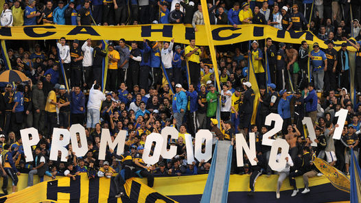 boca_juniors_fan_holding_letters_that_spell_relegation_making_fun_of_river_plate.jpg