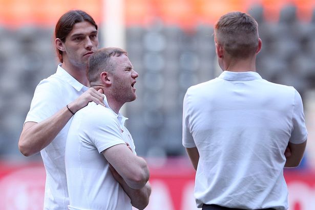 England__s_Andy_Carroll__L__and_Wayne_Rooney_on_the_pitch_at_the_Donbass_Arena.jpg