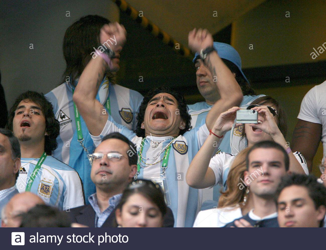 file_photo_argentinas_soccer_legend_diego_maradona_and_his_daughter_giannina_celebrate_in_the_stands_after_agentina_won_the_match_during_the_world_cup_2006_second_round_argentina_vs_mexico_at_the_zentralstadion_stad.jpg