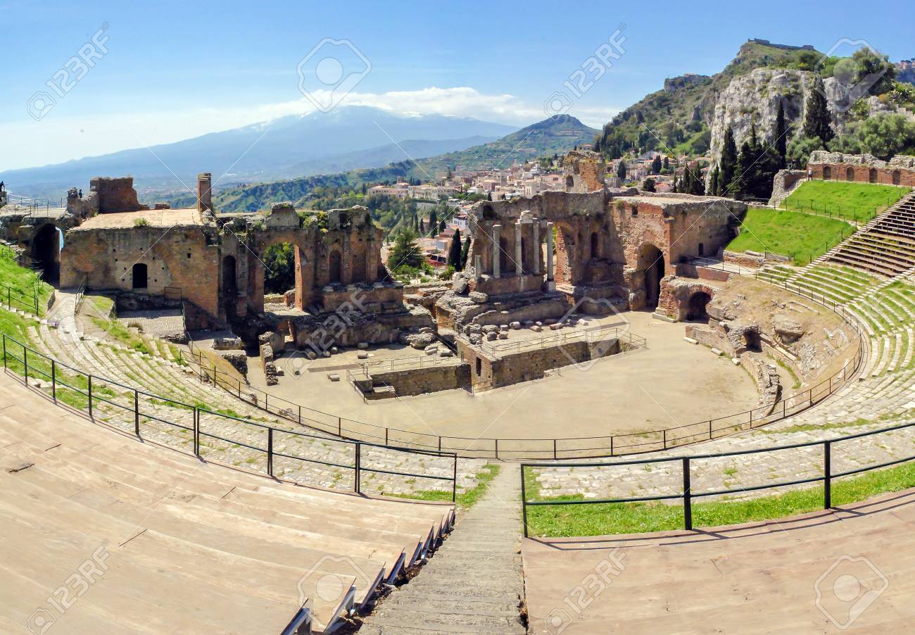 81809381_the_famous_and_beautiful_ancient_greek_theatre_ruins_taormina_with_etna_volcano_in_the_distance_outd.jpg